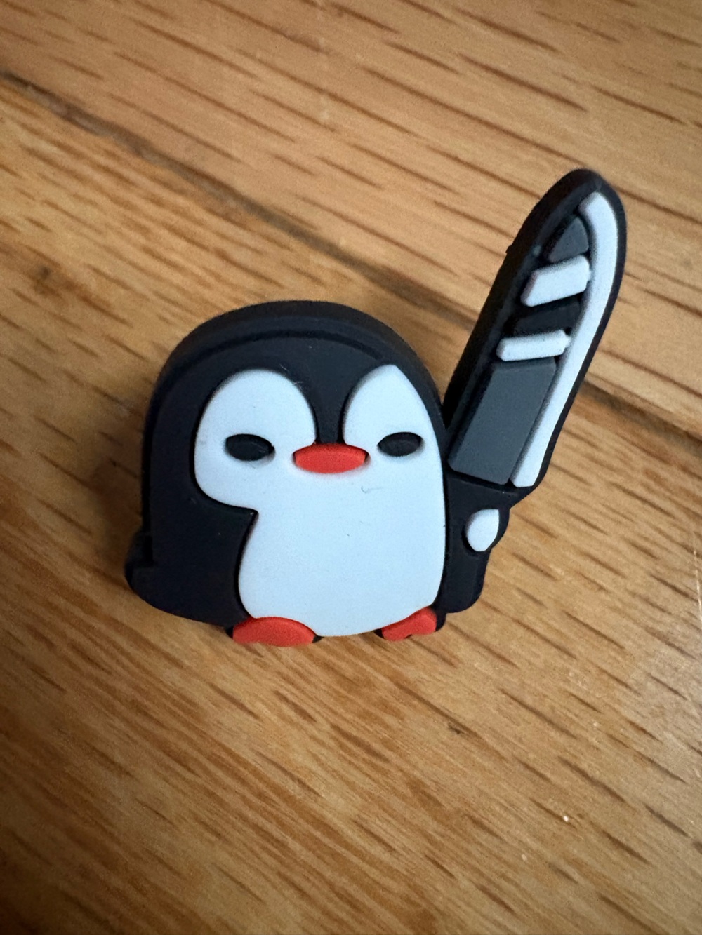 Penguin with knife rubber pin